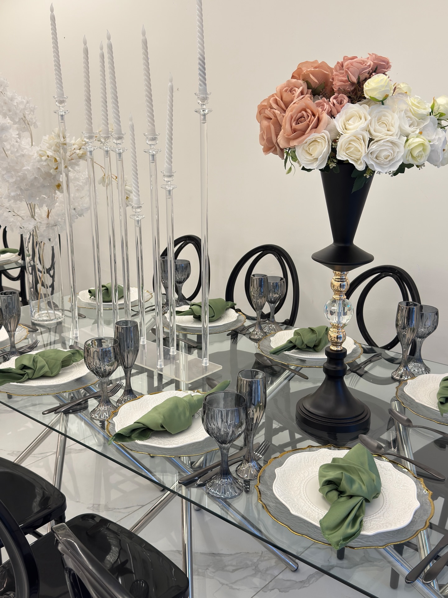 Elegant glass tablescape with crystal candelabras and roses